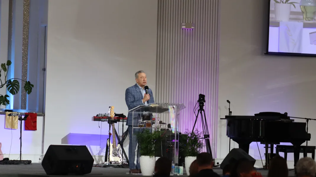 The Bronx church during a service, with the pastor at the altar